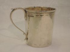 A silver christening mug having bright cut decoration and inscribed Bernard 1922, Sheffield 1919,