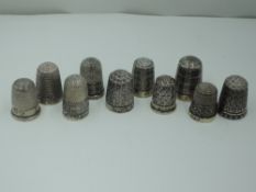 Nine silver thimbles of various patterns, all Chester hallmark dates from 1888 - 1923, all maker
