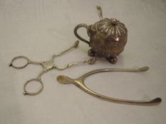 A Victorian silver mustard pot of spherical form having hinged lid, trefoil bun feet, gadrooned