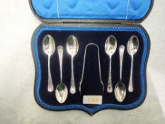 A cased set of six silver teaspoons with matching sugar nips all having brightcut decoration to