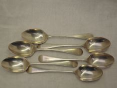 Six Edwardian silver dessert spoons of plain form bearing monogram G to terminals, Chester 1906,