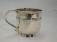 A silver christening mug having reeded decoration and inscribed Eric 1919, Birmingham 1920, Deakin &