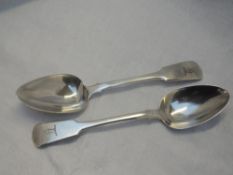 A pair of Georgian silver tablespoons fiddle back form bearing Griffin crest to terminals, Exeter