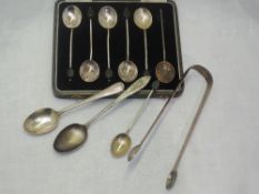 A cased set of six silver coffee spoons having coffee bean knops (1 missing), Birmingham 1930,