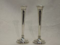 A pair of silver stem vases of classic trumpet form, with weighted bases and bearing oversized