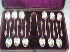 A cased set of twelve Victorian Apostle teaspoons with matching sugar nips, all having twist stems