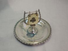 A silver bridge counter having circular saucer with bridge counter to centre, Birmingham 1911, maker