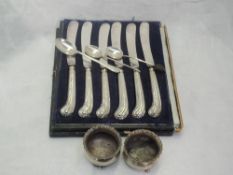 A small selection of HM silver including a set of six silver handled butter knives, a pair of