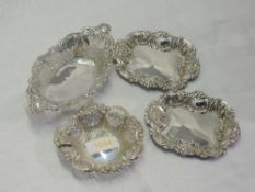 Four HM silver trinket dishes of various forms having moulded and pierced decoration, approx 121g
