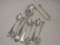 A set of six Georgian silver teaspoons of old English form bearing monogram to terminals, London