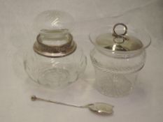 An Edwardian glass preserve pot having cut fern decorative band, silver lid and spoon, London 1907/