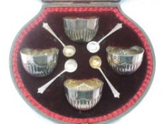 A cased set of four Victorian silver salts of bowl form having gadrooned decoration, London 1896/