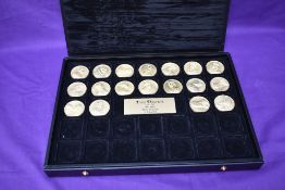 A collection of 18 different Jean Dassier Kings and Queens Medallions in presentation box