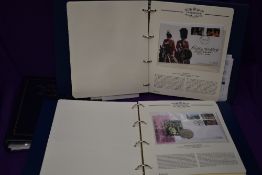Two albums of GB & Commonwealth Coin Covers and First Day Covers, along with an empty album