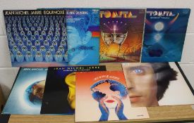 A lot of eight electronic interest albums by Tomito and Jean-Michel Jarre