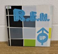 A vinyl copy of REM's ' Up ' long player - like the other REM albums listed these sold more on CD at