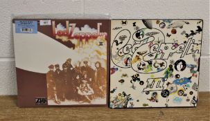 A lot of two Led Zeppelin albums - a double repress with extras and a later issue on orange, green