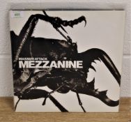 A copy of 'Mezzanine ' by Massive Attack ex / ex