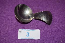 A Keswick school of industrial arts caddy spoon having hammered detailing, marked underside KSIA