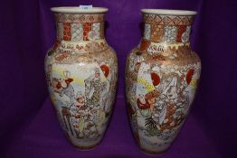 Two large highly decorated oriental vases.