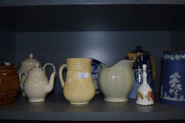 A varied lot of vintage ceramics and glass including jugs, tea pots and decanters.