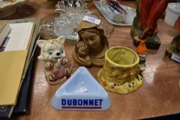 A collection of quirky collectable items including Dubonnet ash tray, Italian religious figurine,