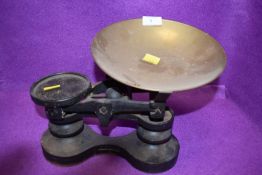 A set of cast kitchen balance scales by Victor having brass bowl