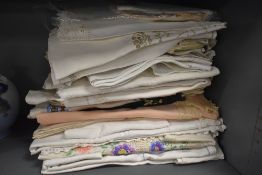 A good selection of table cloths and place settings including crochet needle worked and hand