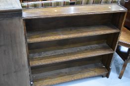 An Edwardian oak framed book shelf 97cm long and 92cm tall