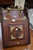 A Victorian mahogany and brass coal purdonium