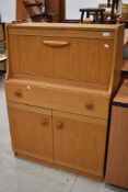 A vintage laminate teak effect bureau, width approx. 79cm