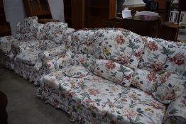 A modern three piece lounge suite having loose covers