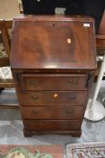 A reproduction mahogany dwarf bureau, width approx. 52cm