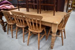 A traditional pine kitchen table and four similar solid seat chairs, table dimensions approx. 183