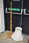 A wooden pine standard lamp