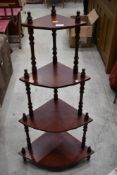 A mahogany effect corner unit or plant stand