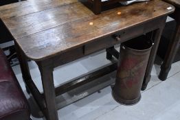 An antique cottage farm house side table in a provincial French design having chamfered and pegged