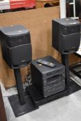 An Aiwa music centre with speakers and Sony compact disk player