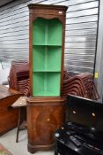 A reproduction Regency style mahogany corner display with open shelves over cupboard, height approx.