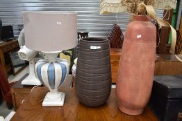 Two modern vases, and a similar lamp