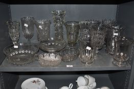 a large lot of vintage glass vases and similar.
