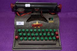 A vintage Lilliput Typewriter.