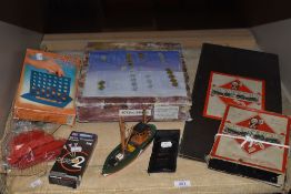 A quantity of vintage board games including monopoly.
