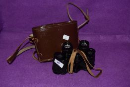 A pair of vintage Krauss binoculars and case.