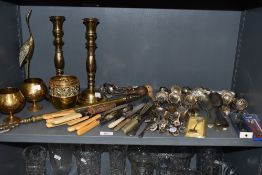 A collection of vintage brass and flat ware including souvenir spoons, sugar sifting spoons and