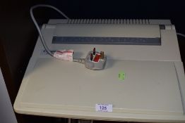 A Cannon electric typewriter.