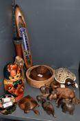 A selection of treen including matryoshka dolls, bowls and former mill shuttle/bobbin thermometer.