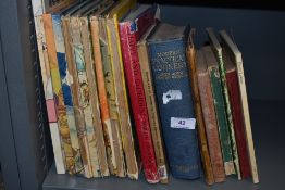 An assortment of vintage books including cookery and Rupert bear.