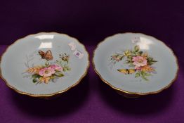 Two vintage cake stands having duck egg blue ground,gilt edging and hand painted dog rose and fern