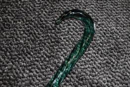 A twisted glass walking cane.